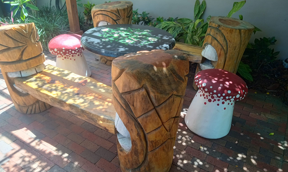 tiki benches carved from old growth Florida pine
                trees